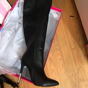 Over the knee black leather boots